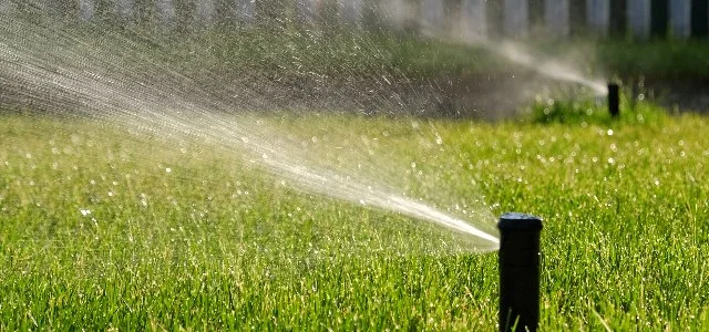 Sprinkler heads running on green lawn in Upper Saddle River, NJ.